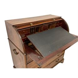 Mid-to-late 20th century camphor wood roll top campaign bureau, the cylinder roll opens to reveal document divisions, small drawers, cupboard and sliding writing surface, fitted with four graduating drawers, heavy brass carrying handles to each side, on bracket feet
