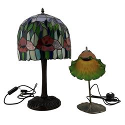 Tiffany design table lamp, with floral domed glass shade and bronzed base, H61cm, together with an Art Nouveau design bronzed side lamp with coloured glass shade (2)