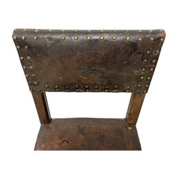 Mid-17th century oak joined backstool or chair, upholstered in brown leather with stud work, turned front supports joined by plain stretchers
