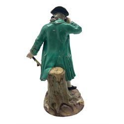 Late 19th century Meissen figure 'The Racegoer' dressed in period costume with telescope and walking cane, modelled after Michel Victor Acier, blue crossed swords mark, incised D65, H21.5cm 