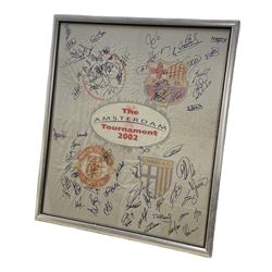 Large framed banner for the 2002 Amsterdam Tournament signed by players from the four competing teams Ajax, Manchester United, Barcelona and Palma, including David Beckham, signatures in black and purple marker pen, 91cm x 108cm 