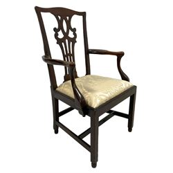 Georgian elm open armchair, the shaped cresting rail over pierced interlaced splat, curved arms and supports, drop-in seat cushion upholstered in floral silk fabric, on square supports with inner chamfer united by plain stretchers 
Provenance: From the Estate of the late Dowager Lady St Oswald