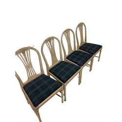 Set of eight bleached walnut Edwardian dining chairs, the carved cresting rail and pierced splat over drop in seat pad, raised on turned supports