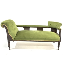  Victorian stained walnut chaise longue sofa, with leaf carved decoration, upholstered in green velvet, raised on turned supports and castors, L171cm, D63cm, H79cm  
