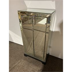 Bevelled mirrored cabinet fitted with two cupboards, ebonised base 