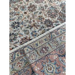 Fine beige ground silk rug, duck egg blue medallion and spandrels, field with interlaced foliate, double guarded border 321cm x 215cm