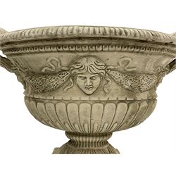 Pair of Classical design composite stone handled oval urn planter, decorated with linen swags and masks, gadroon moulded underbelly on acanthus leaf footed base on stepped square plinth