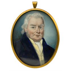 19th century oval miniature portrait, watercolour on ivory of a gentleman wearing a blue coat and yellow waistcoat 7cm x 5cm.  Trade card inside, incomplete, inscribed 'Mr Thomas Miniature Painter' possibly Thomas Cox. This item has been registered for sale under Section 10 of the APHA Ivory Act
