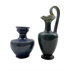 Linthorpe pottery jug with high loop handle and crimped spout no. 1064 H22.5cm, together with a blue glazed vase, unmarked (2)