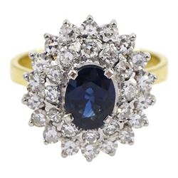 Gold oval sapphire and round brilliant cut diamond cluster ring, stamped 18ct