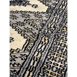Afghan design Bokhara ground runner rug, with repeating gul motif on grey field, enclosed by multi line border, 334cm x 80cm 