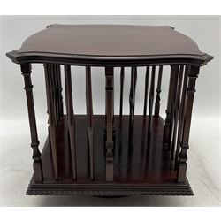 Edwardian mahogany tabletop bookcase, shaped moulded top over turned spindle balestrade and stepped square columns, on circular revolving base 