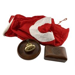  Training Ship flag, vintage ships wheel nut cracker and an early 20th century Indian hardwood cigarette box, the hinged lid carved with the crest of the Royal Engineers Bombay Sappers and Miners (3)