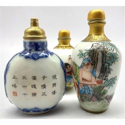 Three Chinese snuff bottles decorated with erotic scenes and blue character marks to base, tallest 9cm