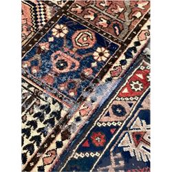 Turkish hand knotted ground rug, centred with red field and decorated with stylised floral design (122cm x 210cm) together with a Persian design garden rug (272cm x 155cm)