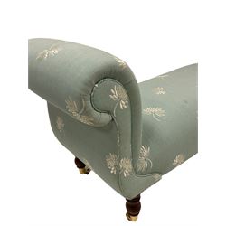 Victorian design window seat, upholstered in green fabric, with two scrolled arms, raised on turned supports, terminating in brass castors 