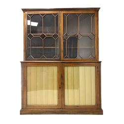George III mahogany library bookcase on cupboard, the moulded cornice over two astragal glazed doors, each enclosing two adjustable shelves, two doors under with later glazed panels enclosing further adjustable shelves, raised on skirted base W159cm, H212cm, D56cm