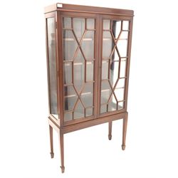 20th century mahogany display cabinet, with two astragal glazed doors enclosing three adjustable shelves, raised on square tapered supports with peg feet, W78cm, H149cm, D30cm