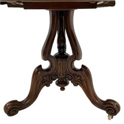 Victorian inlaid walnut breakfast table, figured tilt-top with quarter-matched veneers, inlaid with trailing foliate decoration within stringing, open pedestal base with shaped and moulded uprights and central turned supports, carved with scrolls and foliage, three shaped splayed supports with scroll terminals, on brass and ceramic castors
