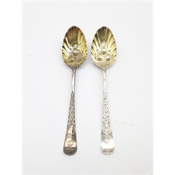 Pair of 18th Century silver table spoons, later decorated and gilded with berry bowls and engraved stems, stretcher marks.