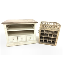 Rustic painted hardwood TV/HI FI cabinet, fitted with three drawers and raised on castors, (85cm) together with a wicker wine basket, (W50cm) and a campaign style coffee table, (W107cm)