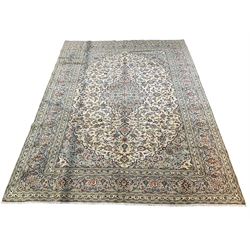 Large ivory Persian hand knotted rug, with one central medallion surrounded by multi-border and overall floral motifs 