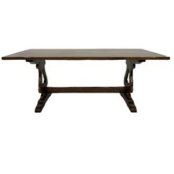Oak dining table, raised on panel end supports, terminating in sledge feet, united by a stretcher W183cm, D90cm, H75cm