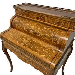 Mid-20th century French Kingwood bureau de dame or writing desk, raised galleried top fitted with three small drawers, the pull-out drawer opens the cylinder top revealing drawers and folding writing surface, inlaid throughout with scrolling foliate and flower heads, on cabriole supports mounted by ornate gilt metal castings 