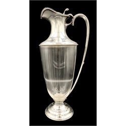 Edwardian silver mounted claret jug, the plain tapering glass body with silver collar, pierced thumb piece, elongated handle and beaded borders, raised on conforming domed foot, hallmarked Walter & Charles Sissons, Sheffield 1906 and retailed by Asprey of London, H27cm 