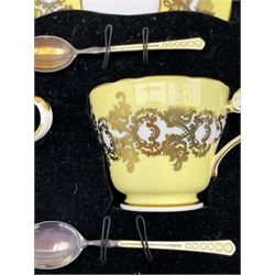 1950's cased set of six Aynsley cups and saucers, yellow and gilt decorated with a set of six silver guilloche enamel teaspoons by Turner & Simpson, 1957, pattern no. 1215