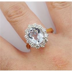 18ct gold oval aquamarine and round brilliant cut diamond cluster ring, hallmarked, aquamarine approx 2.10 carat, total diamond weight approx 0.70 carat