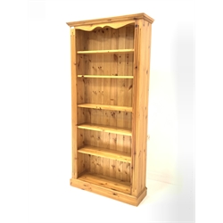  Solid pine open bookcase with fluted decoration enclosing five adjustable shelves, W89cm, H183cm, D29cm   