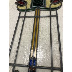 Early 20th century Art Nouveau period stained and leaded glass panel, stylised tulip design 74cm x 40cm