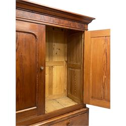 19th century pitch pine housekeeping cupboard, projecting cornice over figured frieze, enclosed by two panelled doors, fitted with two short and two long drawers, on bracket feet