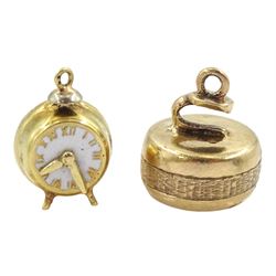 14ct gold clock charm and a 9ct gold curling stone charm