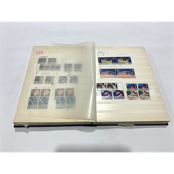 Great British Queen Elizabeth II mostly mint, mostly decimal stamps, face value of useable postage over 100 GBP,  in one album