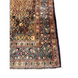 Persian Mood carpet, overall golden ground, central flared star medallion surrounded by a field of Herati motifs, cusped blue and orange ground spandrels, the border with multiple guards decorated with stylised flower head and Boteh motifs 