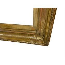 Pair of 20th century giltwood and gesso rectangular wall mirrors, in moulded frame with fluted decoration, applied foliage mouldings to corners and foliate moulded outer edge, plain chamfered slip with plain glass plate