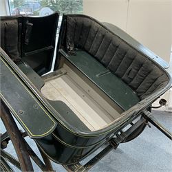 Thomas Cuthbert & Son, Dundee (Scottish 19th century) - Victorian Governess Cart, wooden tub shaped body in dark green painted finish with yellow pinstripe, step-plate and rear access door to the interior with horsehair stuffed upholstered backrests, rubber tyred 16 spoke wheels stamped 'T Cuthbert & Son Dundee' to the hubcaps, fitted with two sconces to the front and 200cm shaft forearms