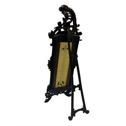 Early 20th century desk thermometer by Franks, Deangate, Machester, with ivorine panel and ornate cast iron frame, surmounted by a Cherub mask, on scroll supports, H32cm