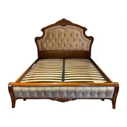 Barnini Oseo - super king 6' 'Reggenza' bedstead, the headboard with raised foliate pediment with central shell motif, scrolling and moulded frame with gilt detail, the headboard and footboard upholstered in pale buttoned fabric, raised on cabriole feet