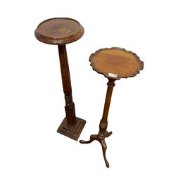 20th century mahogany torchere plant stand, raised on three splayed supports, together with another torchere, raised on fluted and turned pillar leading into stepped base