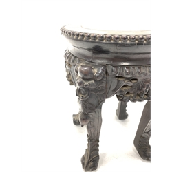 Late 19th Early 20th century Chinese hardwood jardinière stand, rouge marble inset top enclosed by beaded moulding, raised on four floral carved supports 