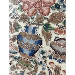 19th century Chinese embroidered panel, worked with coloured and gold threads in the forbidden stitch technique, in the form of an urn surrounded by flowers and precious objects, 26.5cm x 20cm 