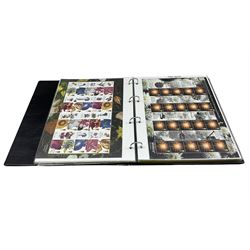 Queen Elizabeth II mint decimal stamps, Royal Mail Smilers most being first class, face value of usable postage approximately 630 GBP, housed in a ring binder 