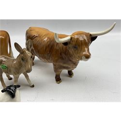 Beswick model of a Highland Cow 1740, Beswick Guernsey Bull 145, Beswick Donkey Foal 2110 and a Black Faced Sheep and Lamb 1765 and 1828 (5)