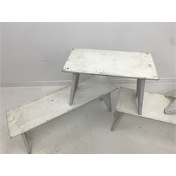 Set three white painted pine benches, rectangular seats raised on shaped panel end supports (110cm x 33cm, H46cm) and a matching smaller bench (66cm x 33cm, H46cm)