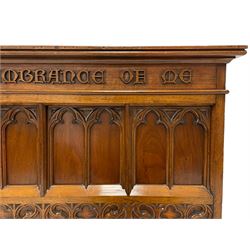 In the manner of Augustus Pugin - 19th century Gothic Revival walnut altar table, moulded rectangular top over frieze inscribed 'this do in remembrance of me', the panelled front and sides with applied tracery work, decorated with band of quatrefoil and S-scroll roundels, square supports with shaped feet