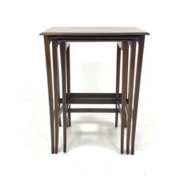 Edwardian mahogany nest of three tables with satinwood banding, raised on slender splayed supports with string inlay W54cm