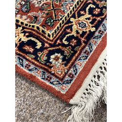 Persian runner rug, stylised floral decoration on busy red field, 321cm x 87cm